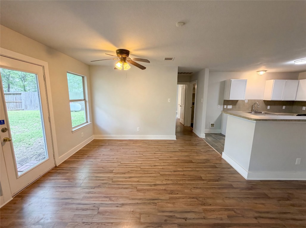 414 Binnacle Way Crosby, TX 77532 - Photo 17 of 22 a view of a kitchen with wooden floor and a kitchen view