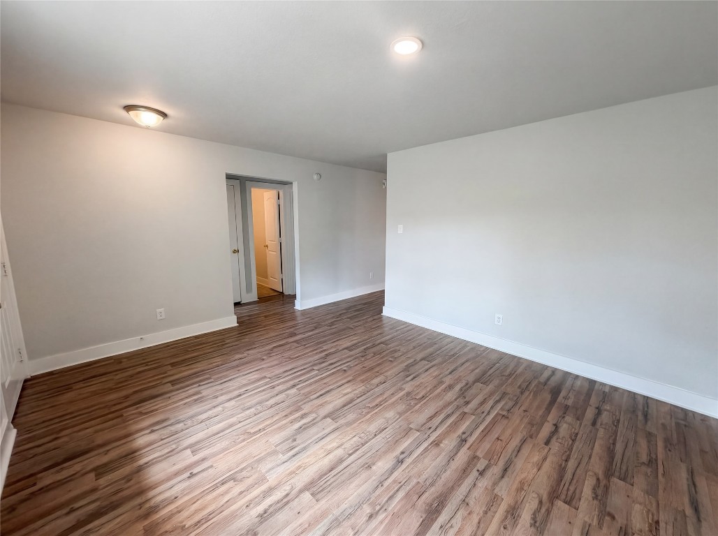 414 Binnacle Way Crosby, TX 77532 - Photo 3 of 22 a view of an empty room with wooden floor and window