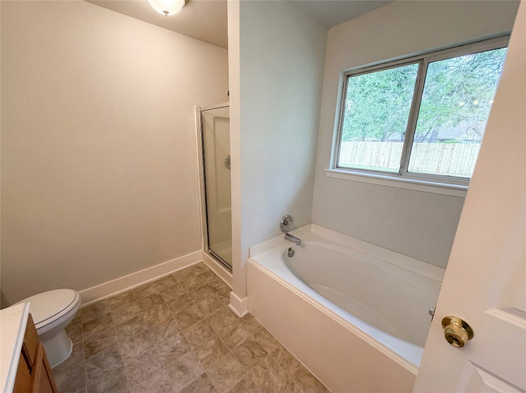 414 Binnacle Way Crosby, TX 77532 - Photo 6 of 22 a white bath tub sitting next to a window