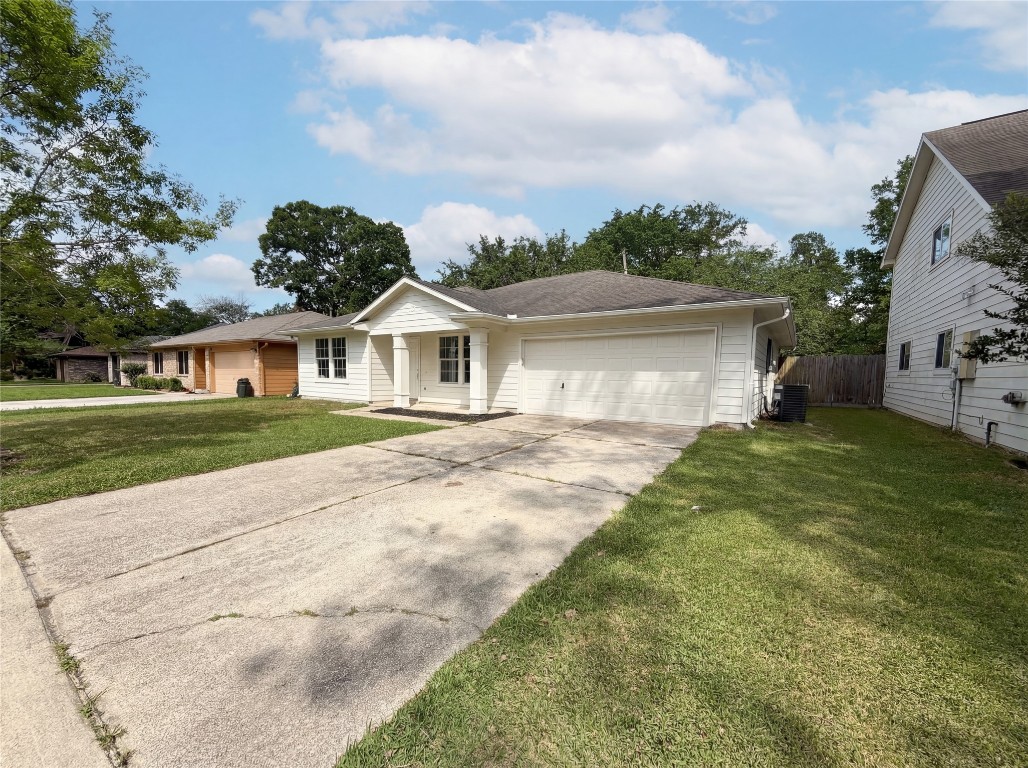 414 Binnacle Way Crosby, TX 77532 - Photo 8 of 22 a front view of a house with a garden