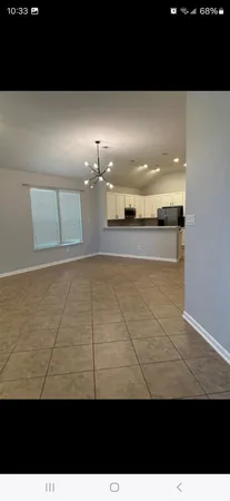 a view of a living room and kitchen
