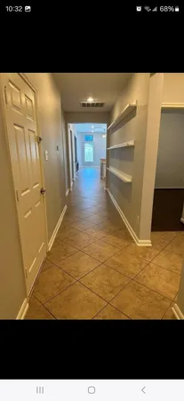 a view of an empty room and window