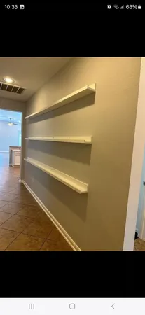 a view of wooden floor and an empty room