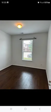 a living room with hard wood floor