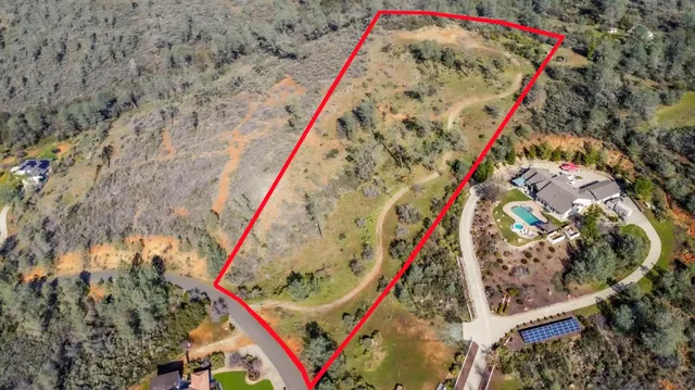 a view of street with parked cars