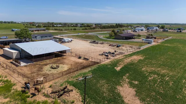 an aerial view of a house with a lake view