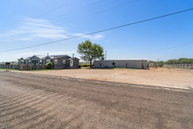 an aerial view of a house with outdoor space