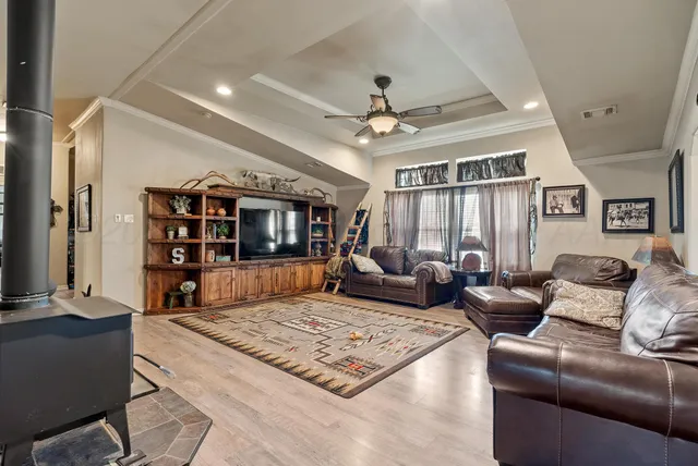 a living room with furniture rug and window