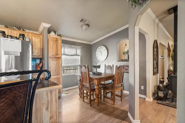 a view of a dining room and hall with furniture