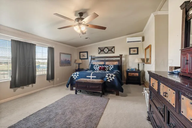 a bedroom with furniture and windows