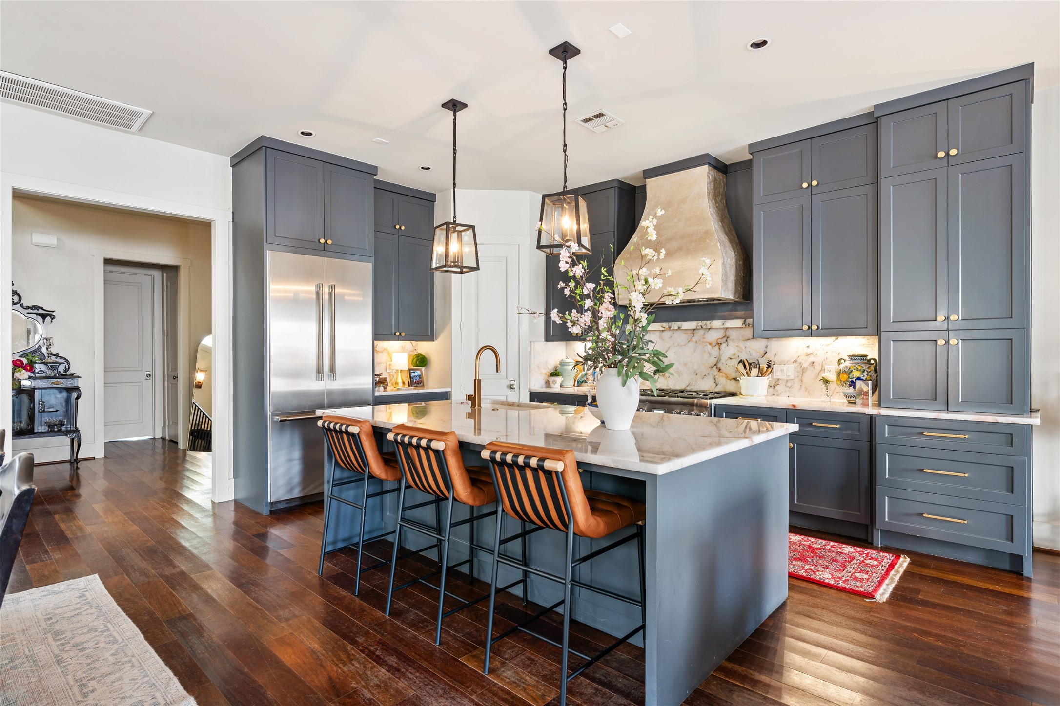 926 Nicholson Street Houston, TX 77008 - Photo 5 of 36 Renovated marble chef's kitchen featuring custom cabinetry, designer lighting, and a generous island.