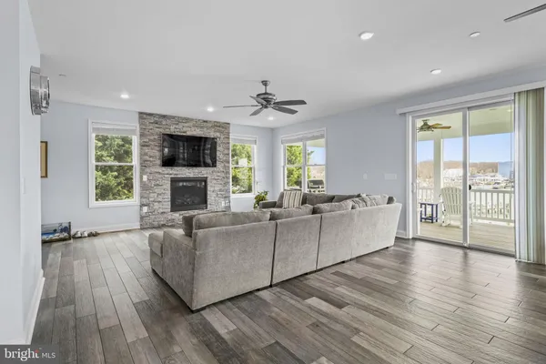 a dining room with furniture and wooden floor