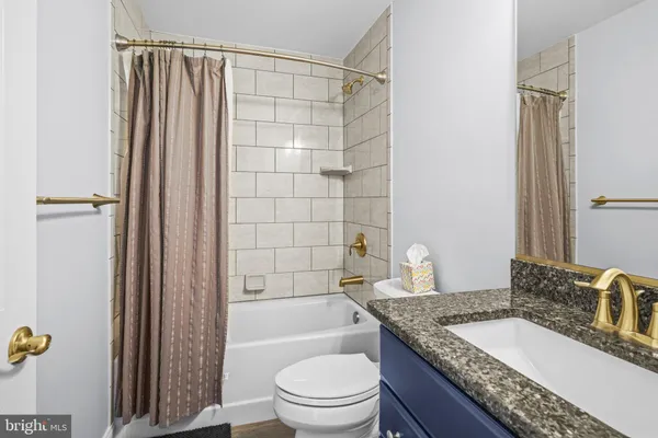 a aerial view of a house with swimming pool garden and trees