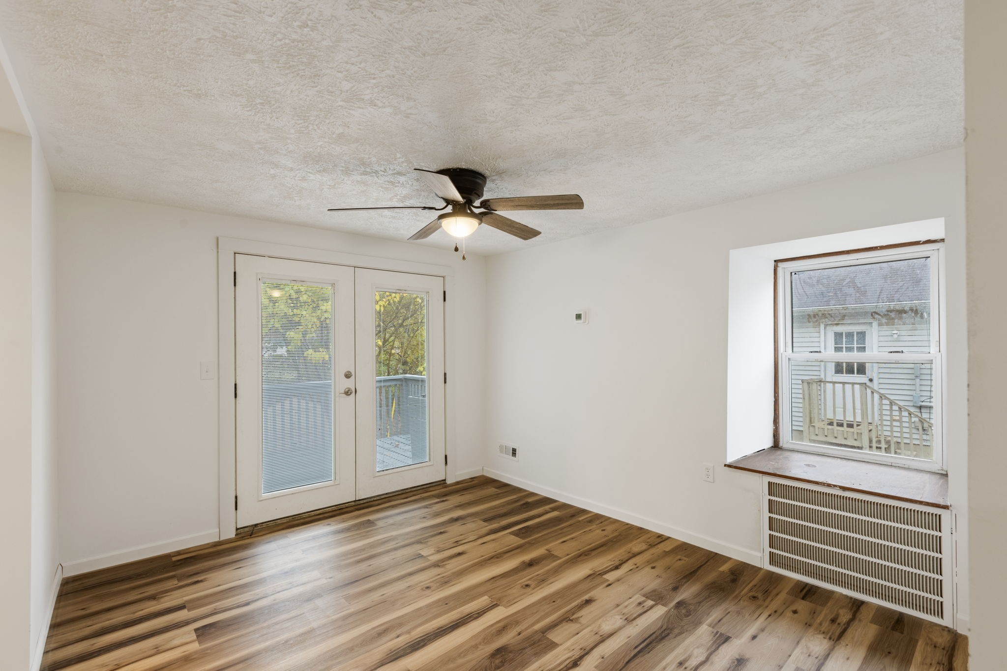 415 Durrett Street Springfield, TN 37172 - Photo 20 of 54 a view of empty room with wooden floor and fan
