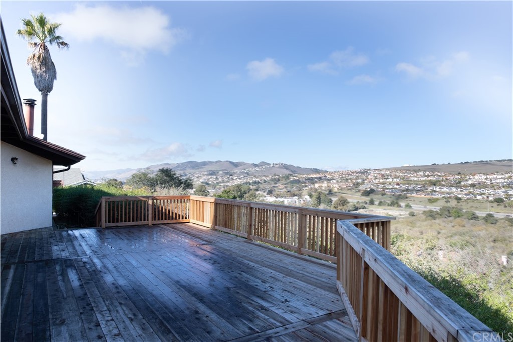 a view of a balcony with wooden floor and a terrace