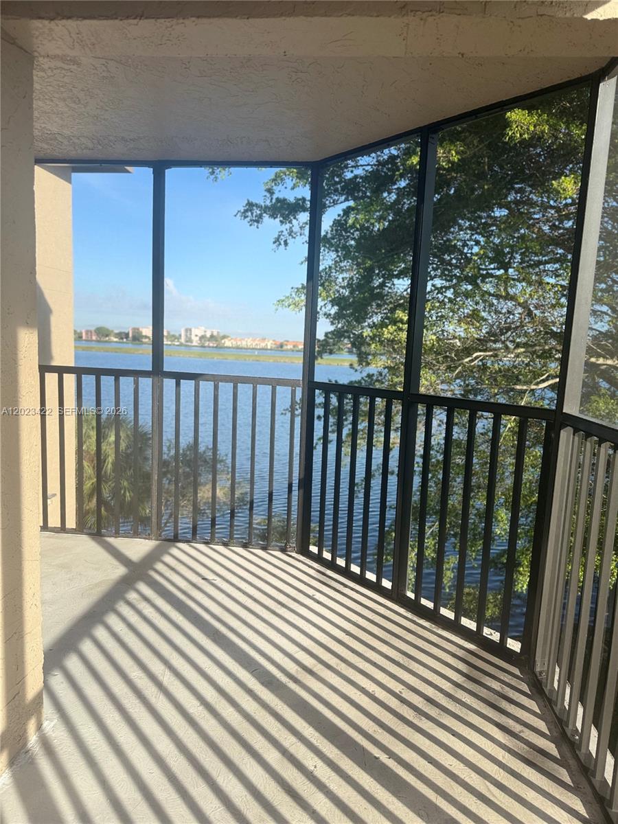 605 Ives Dairy Road, Unit 3067 Miami, FL 33179 - Photo 14 of 28 a view of a balcony with wooden floor