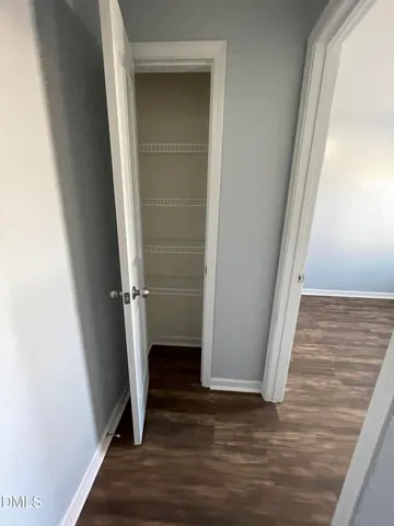 a backyard of a house with fire pit and outdoor seating