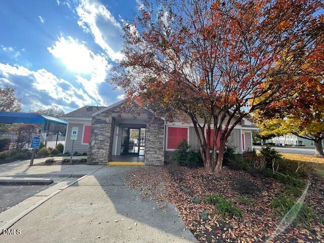 4438 Hillsgrove Road Wake Forest, NC 27587 - Photo 16 of 16 a backyard of a house with fire pit and outdoor seating