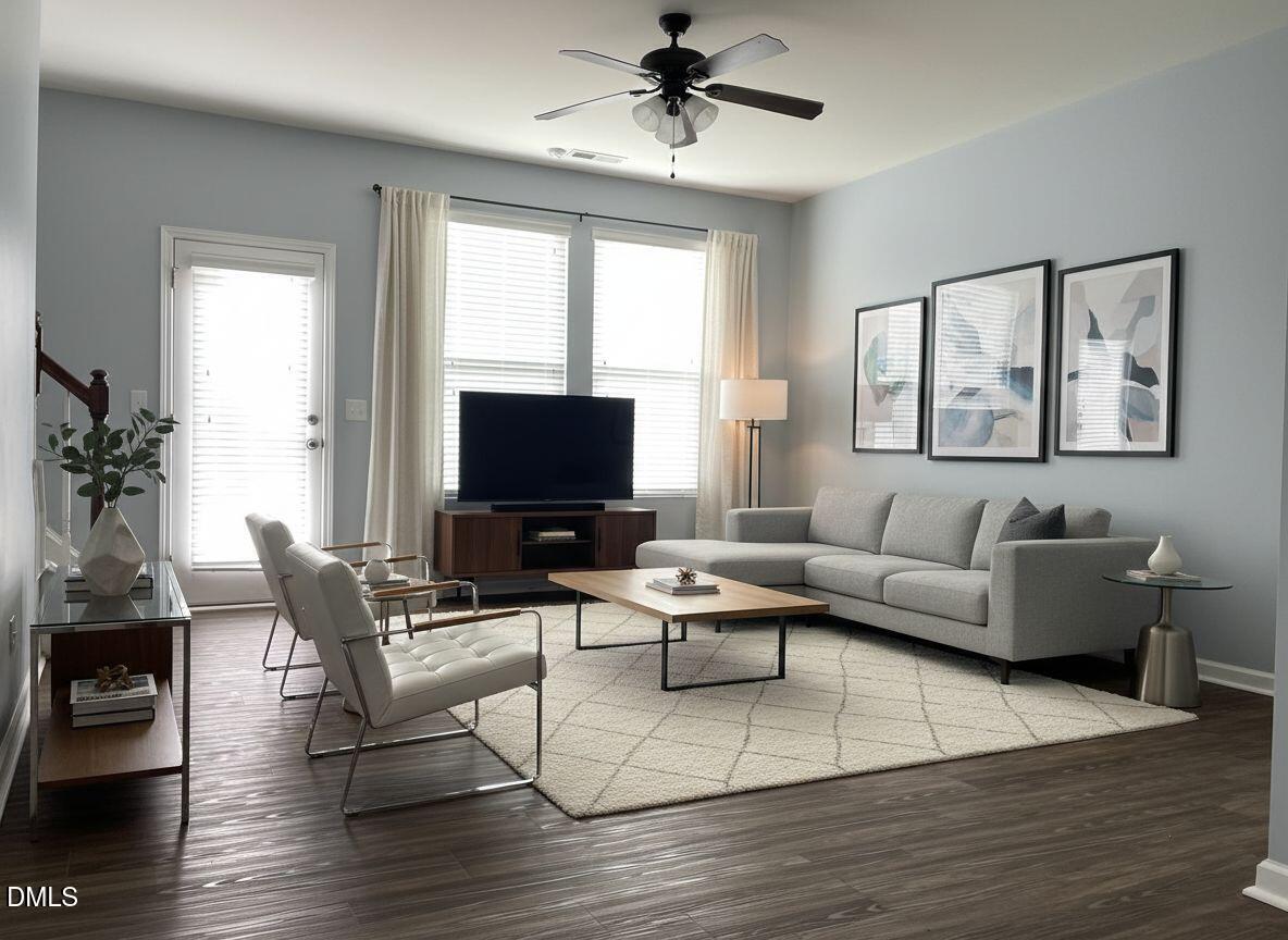 4438 Hillsgrove Road Wake Forest, NC 27587 - Photo 2 of 16 a living room with furniture and a flat screen tv