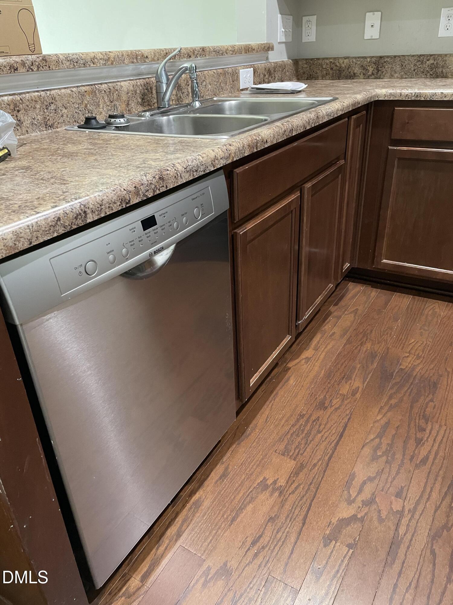4438 Hillsgrove Road Wake Forest, NC 27587 - Photo 5 of 16 a kitchen with granite countertop sink and cabinets