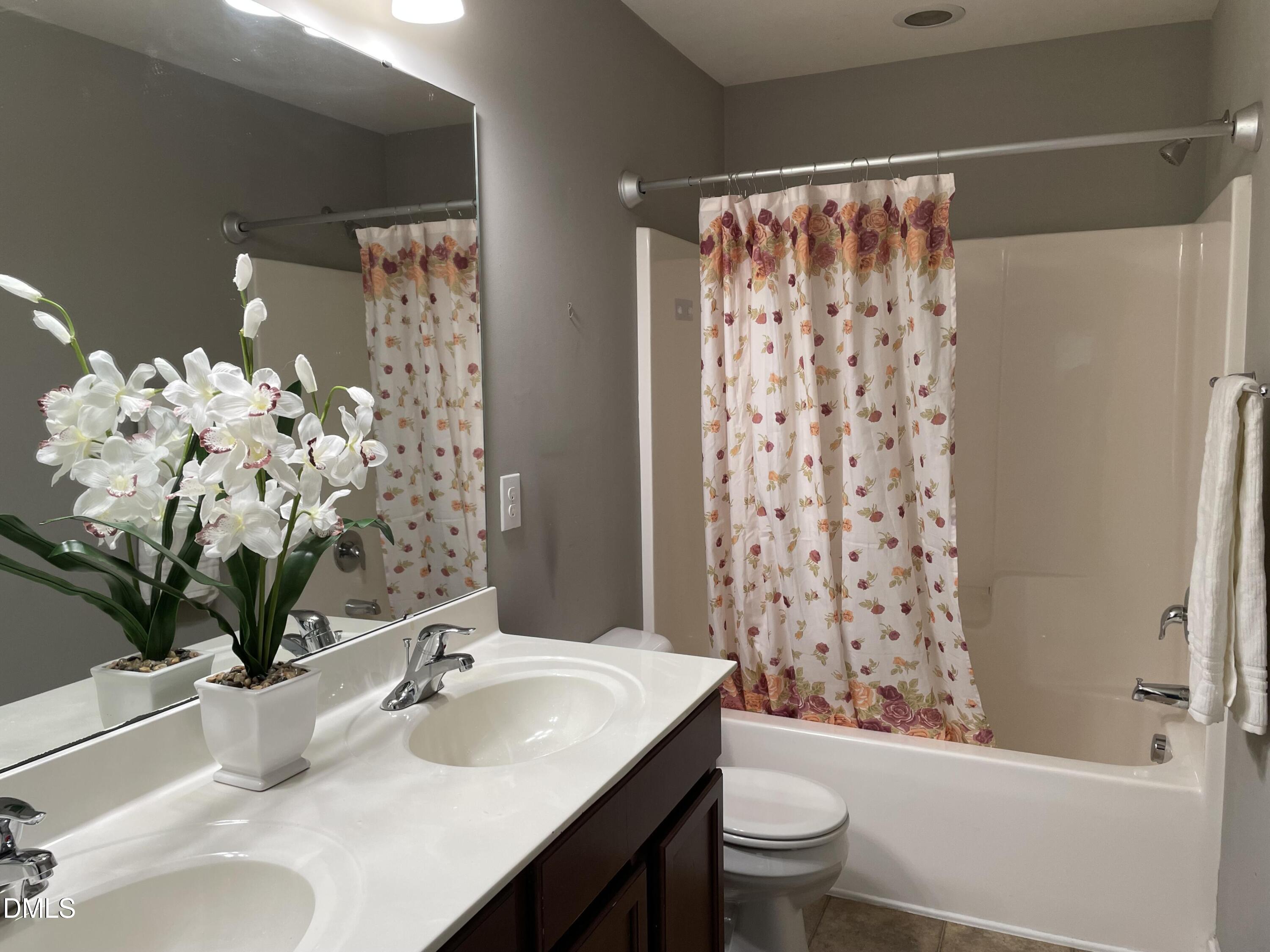 4438 Hillsgrove Road Wake Forest, NC 27587 - Photo 10 of 16 a bathroom with a sink toilet and shower