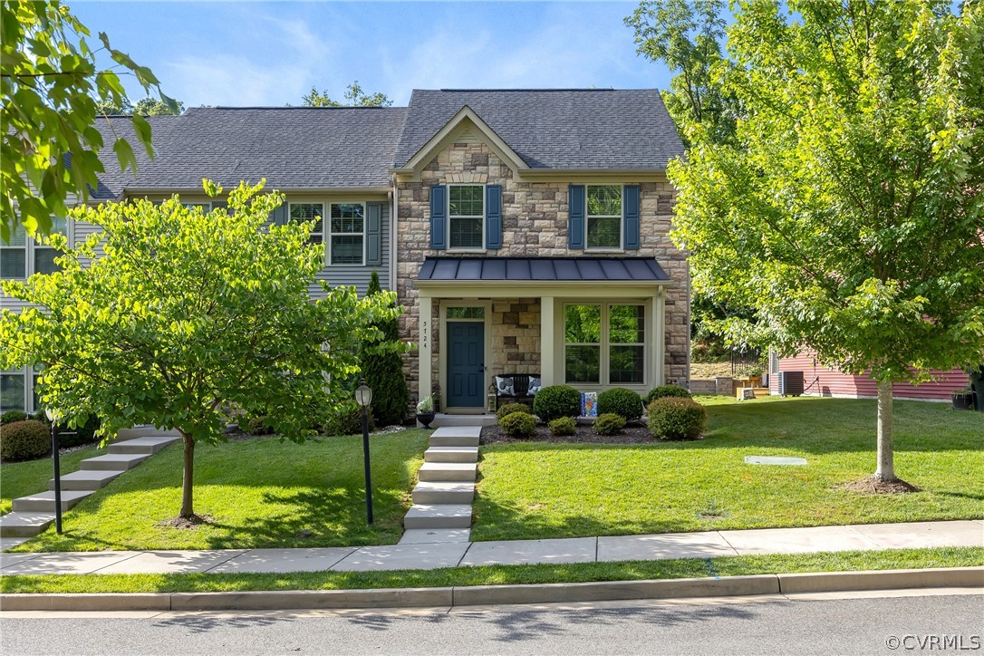 5724 Riverside Place Richmond, VA 23225 - Photo 1 of 47 a front view of a house with garden