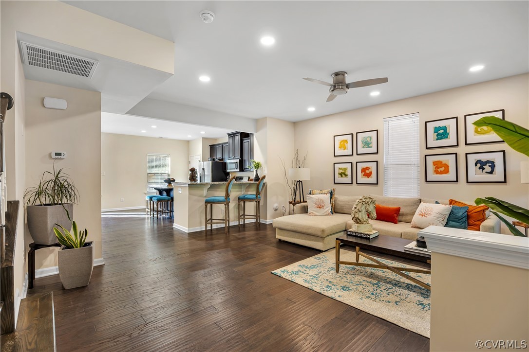 5724 Riverside Place Richmond, VA 23225 - Photo 11 of 47 a living room with furniture and wooden floor