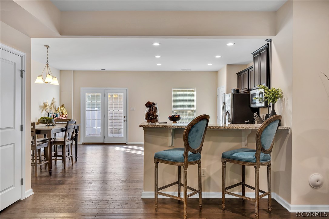 5724 Riverside Place Richmond, VA 23225 - Photo 13 of 47 a view of a dining room with furniture and wooden floor