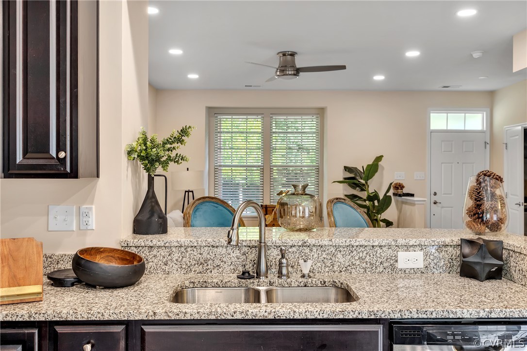 5724 Riverside Place Richmond, VA 23225 - Photo 15 of 47 a kitchen with granite countertop a sink a counter and a potted plant