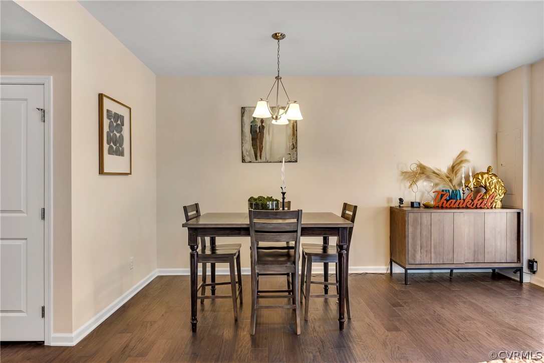 5724 Riverside Place Richmond, VA 23225 - Photo 19 of 47 a view of a dining room with furniture wooden floor and a chandelier