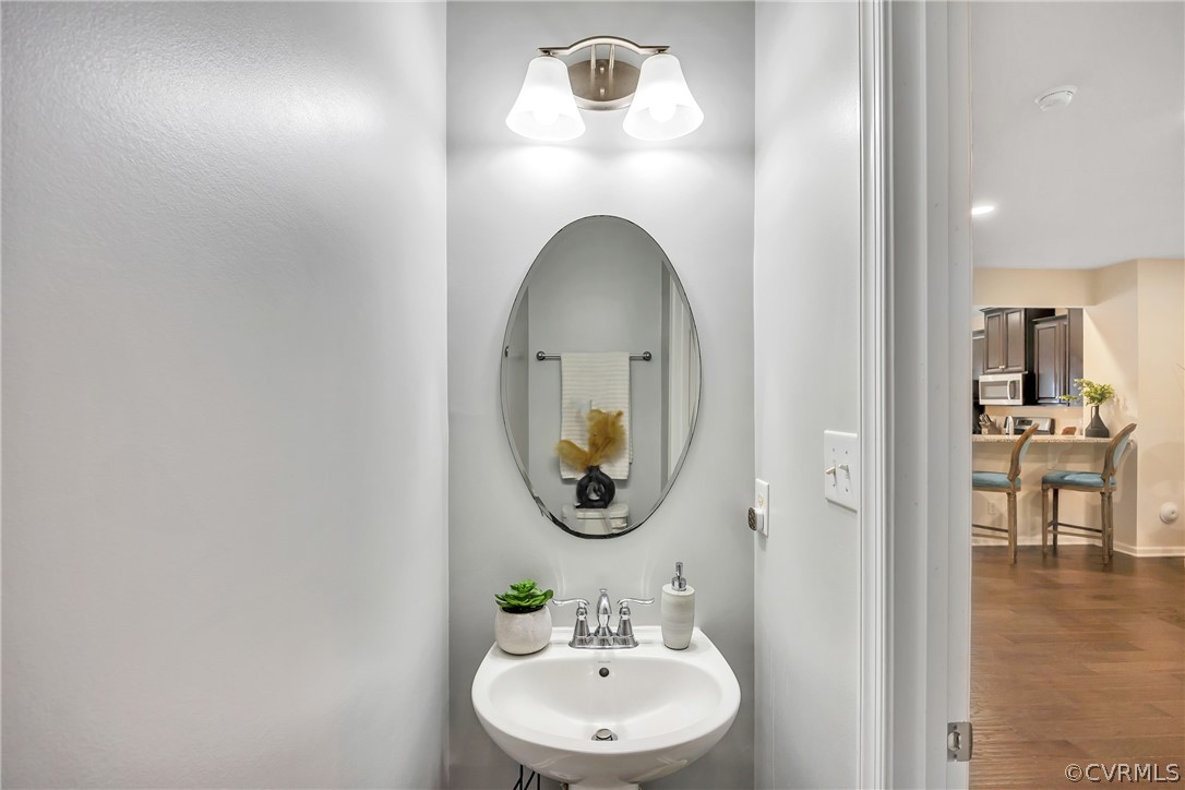 5724 Riverside Place Richmond, VA 23225 - Photo 23 of 47 a bathroom with a sink and a mirror