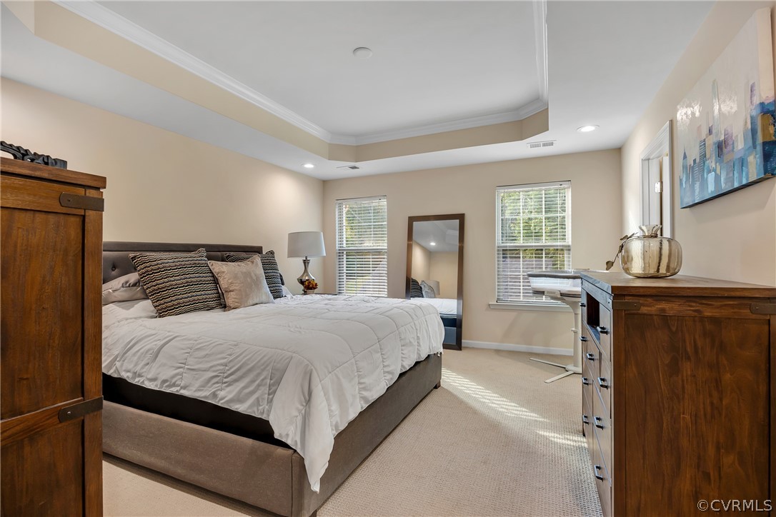 5724 Riverside Place Richmond, VA 23225 - Photo 24 of 47 a bedroom with a large bed and windows