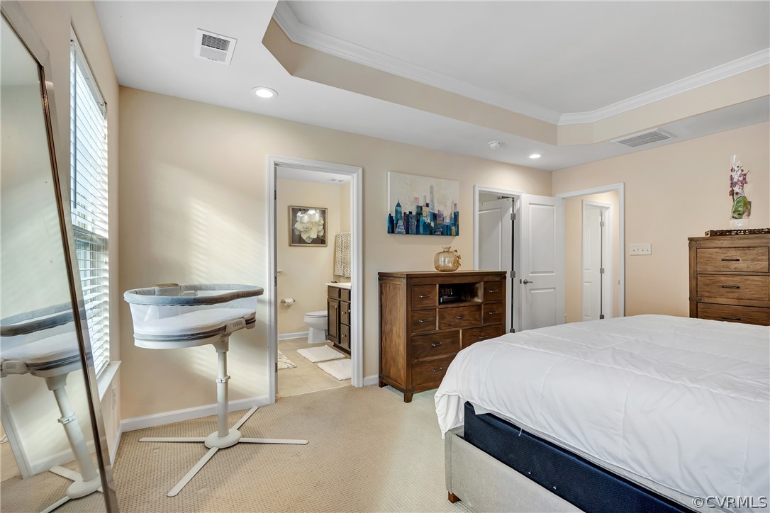 5724 Riverside Place Richmond, VA 23225 - Photo 27 of 47 a bedroom with a bed and a view of kitchen