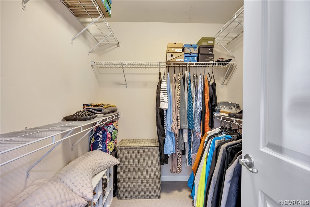 5724 Riverside Place Richmond, VA 23225 - Photo 30 of 47 a view of walk in closet with clothes and shoes