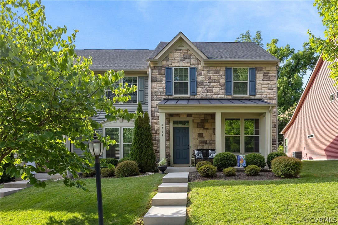 5724 Riverside Place Richmond, VA 23225 - Photo 3 of 47 a front view of a house with garden