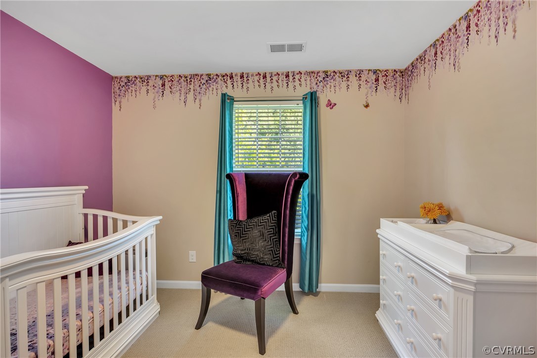 5724 Riverside Place Richmond, VA 23225 - Photo 34 of 47 a bedroom with a bed and a window