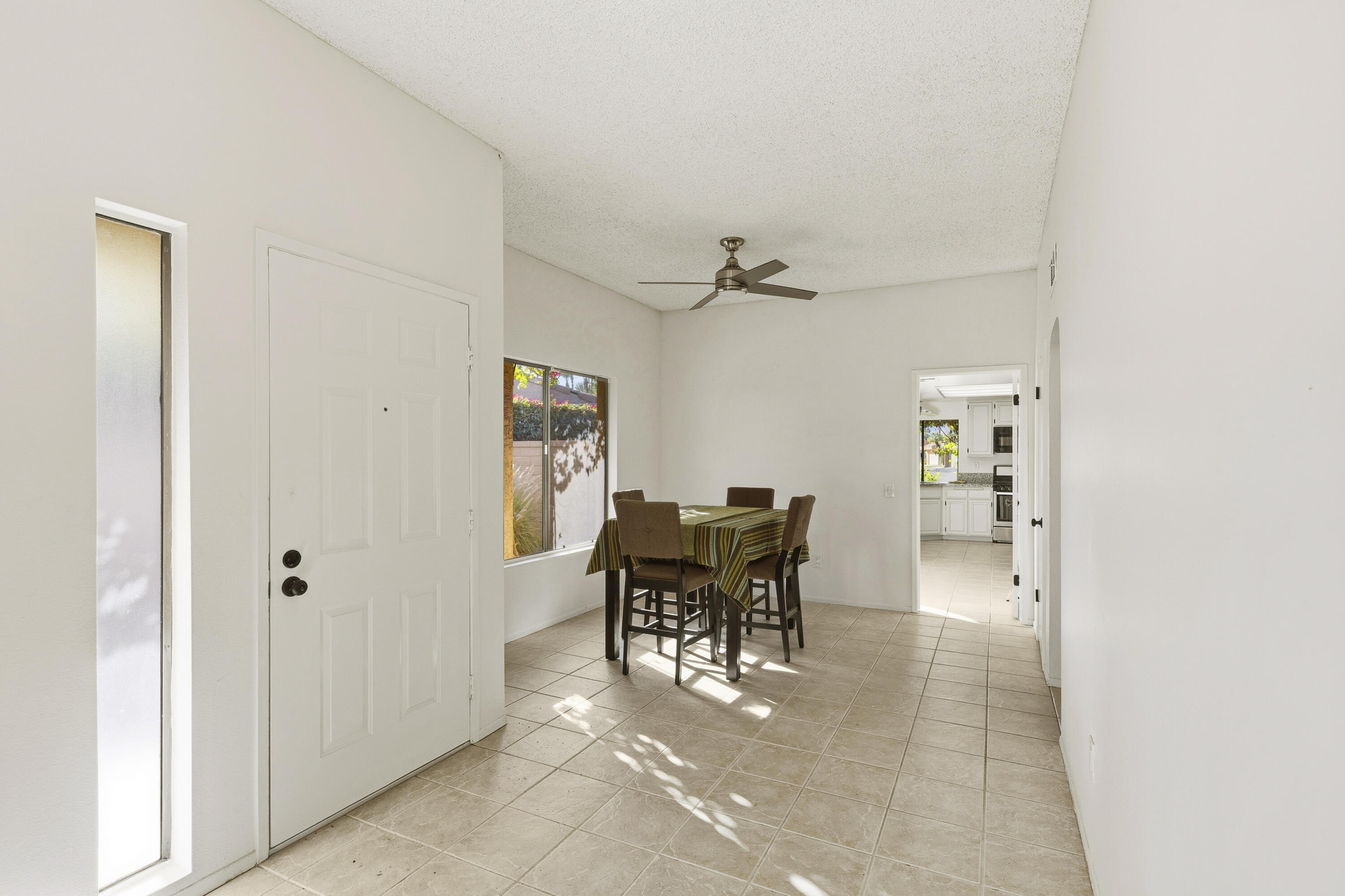 44695 Monaco Circle Palm Desert, CA 92260 - Photo 13 of 58 a dining room with furniture and a table