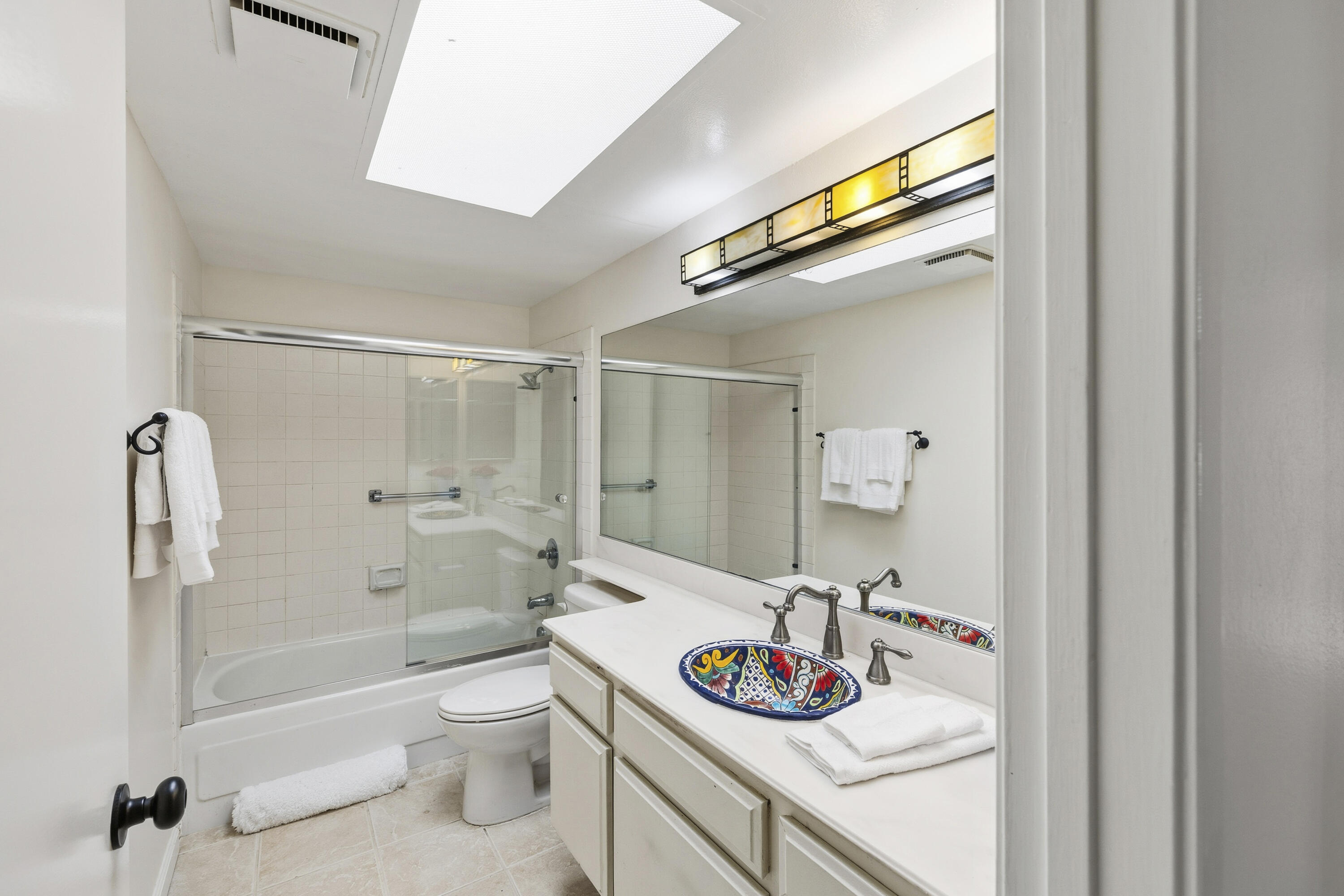 44695 Monaco Circle Palm Desert, CA 92260 - Photo 26 of 58 a bathroom with a sink a toilet and shower