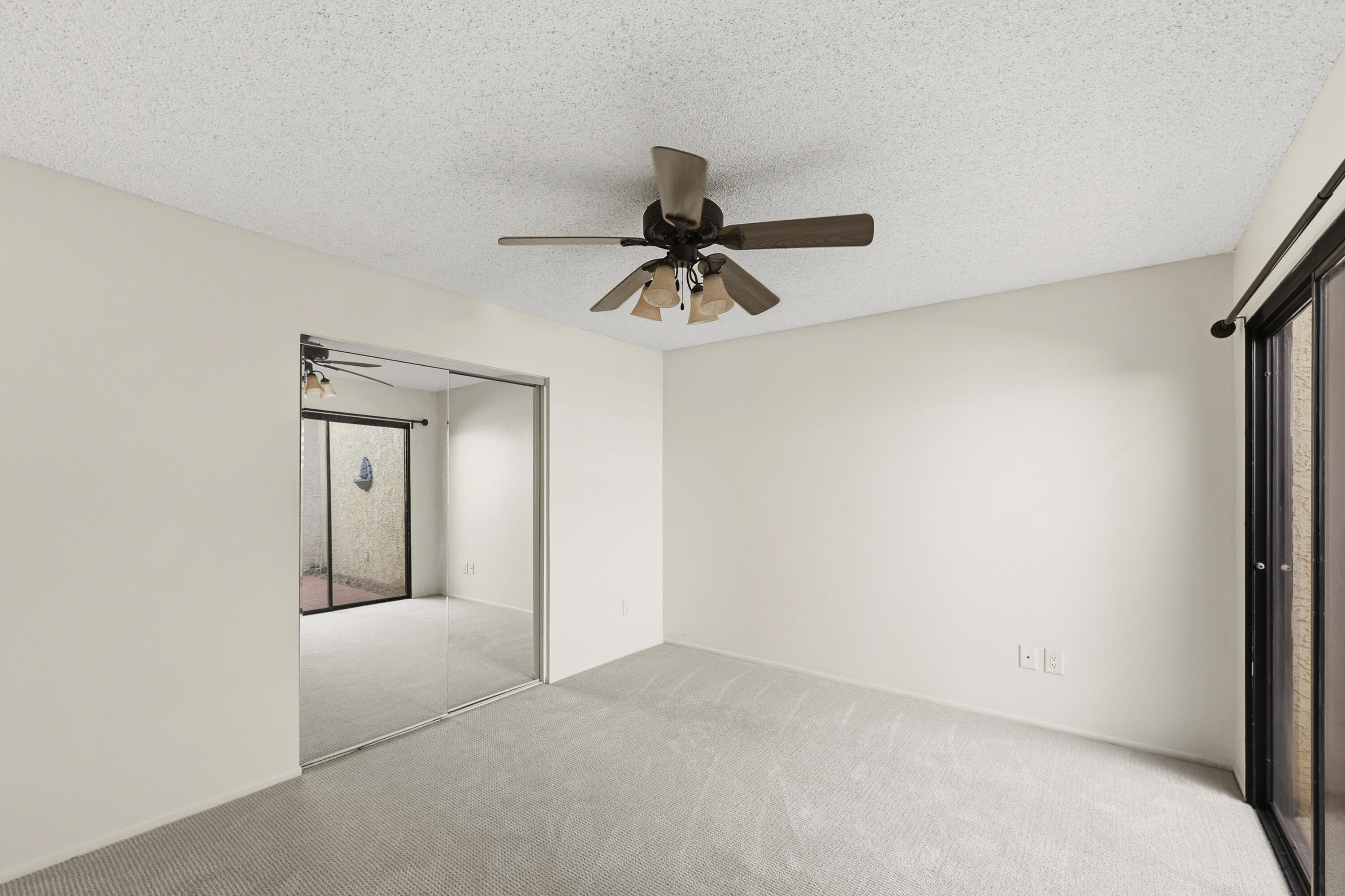 44695 Monaco Circle Palm Desert, CA 92260 - Photo 27 of 58 a view of a hallway with a chandelier