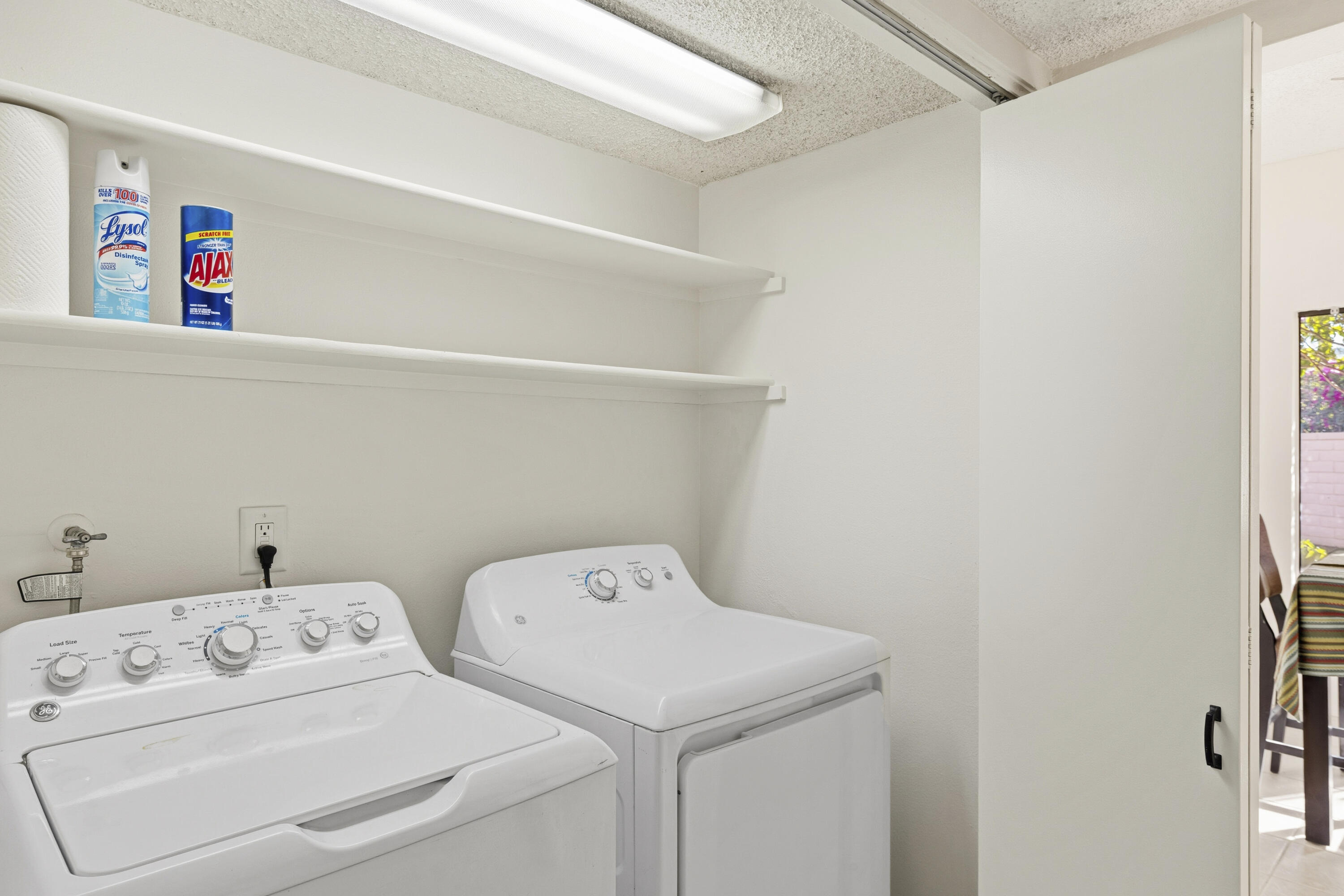 44695 Monaco Circle Palm Desert, CA 92260 - Photo 29 of 58 a utility room with dryer and washer