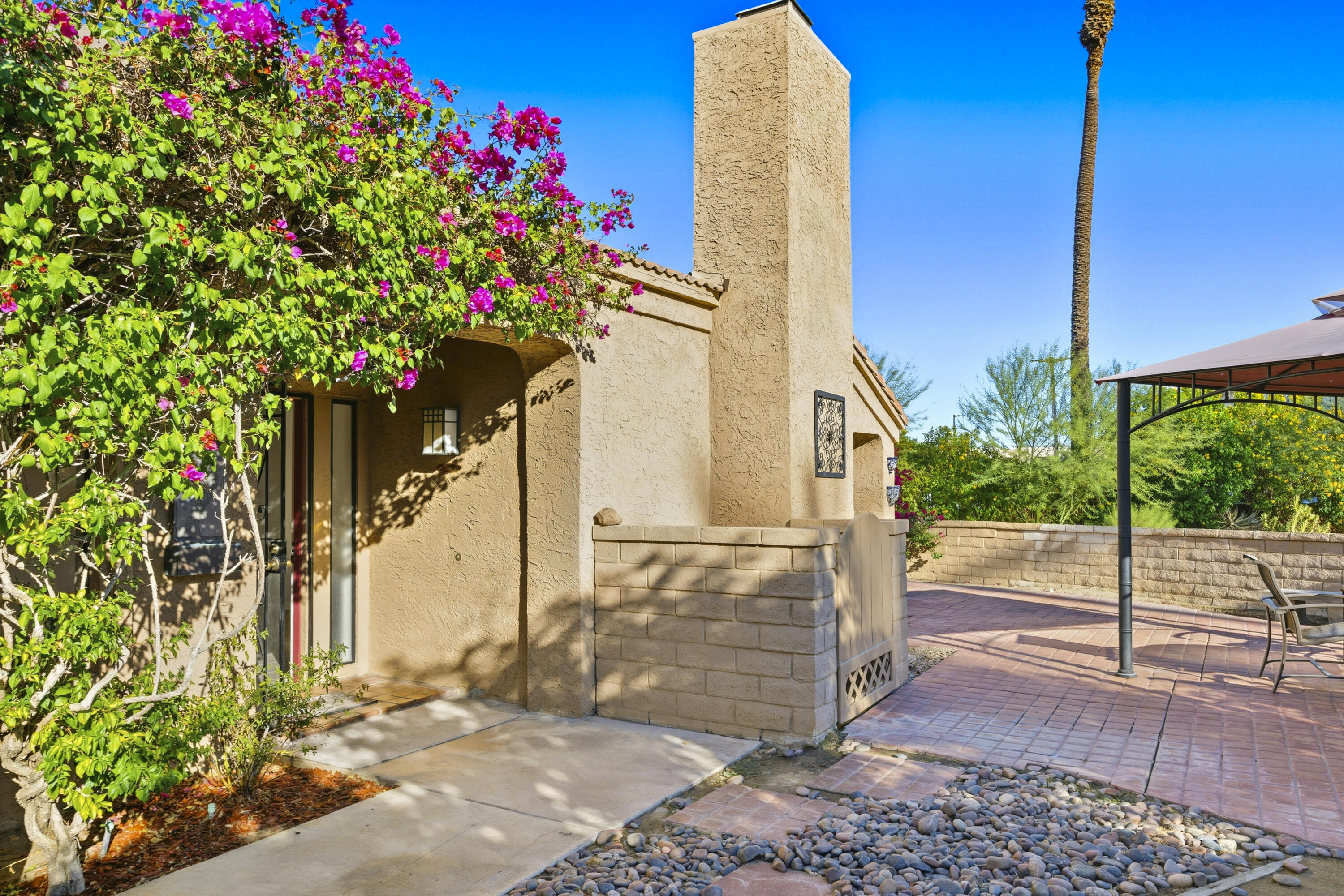 44695 Monaco Circle Palm Desert, CA 92260 - Photo 5 of 58 a flower plants with wooden fence