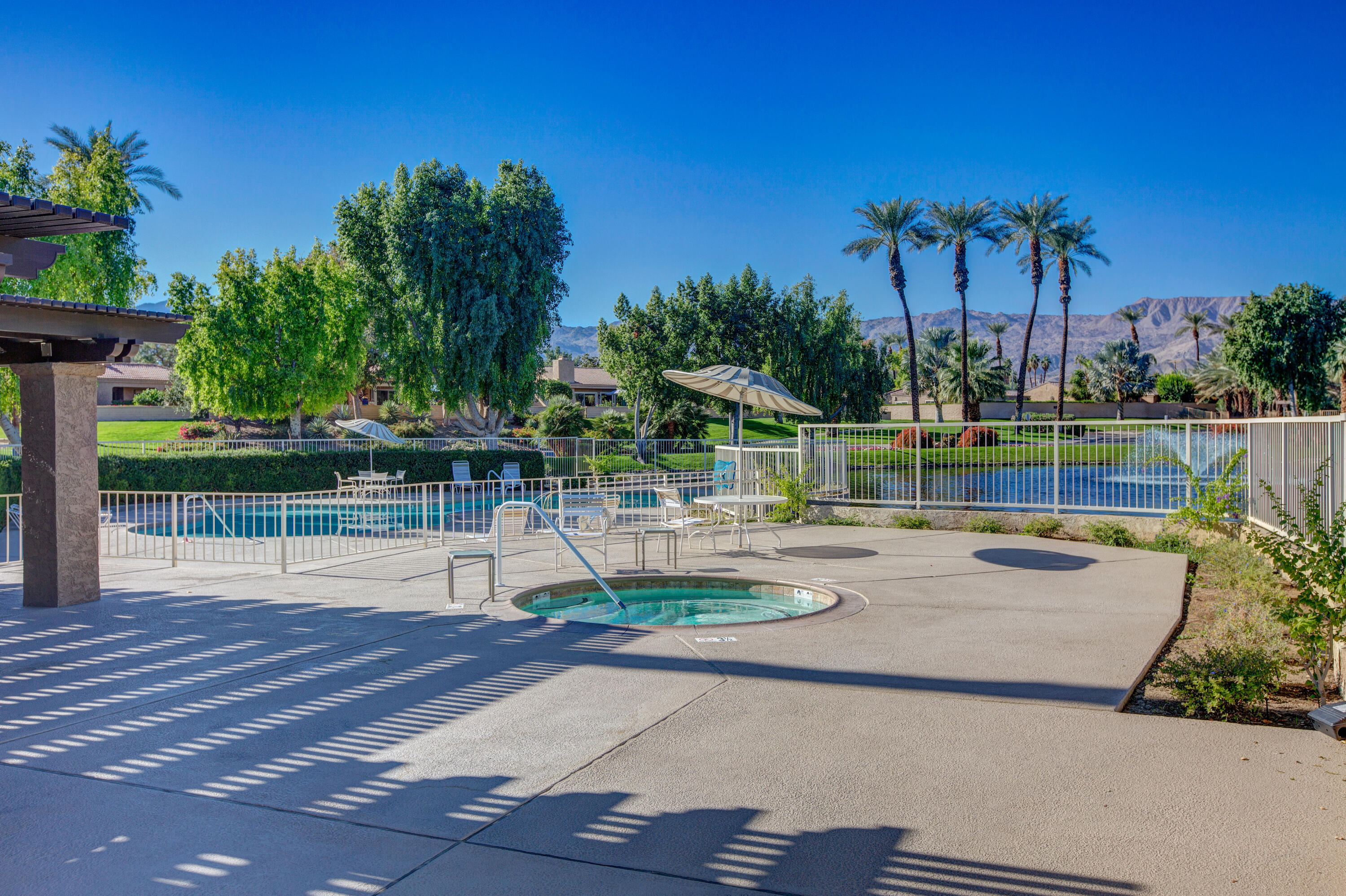 44695 Monaco Circle Palm Desert, CA 92260 - Photo 55 of 58 a view of a swimming pool with a patio