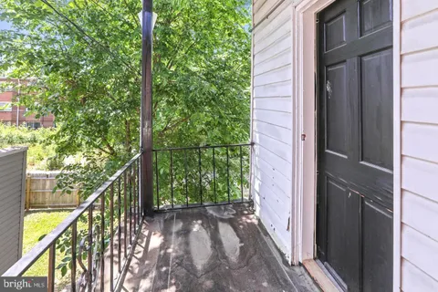a view of balcony and trees