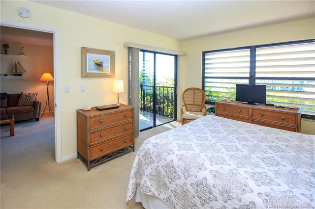 a bed room with a bed and a window