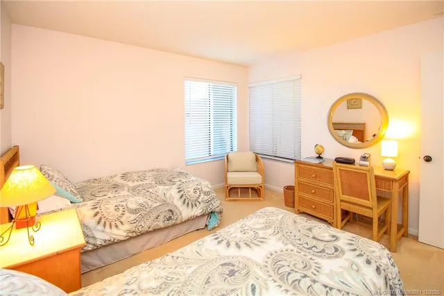 a bed room with a bed and a chair