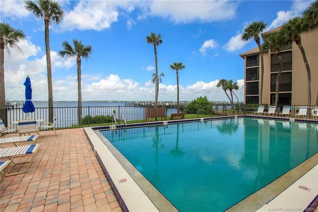 a view of a swimming pool with a lake view
