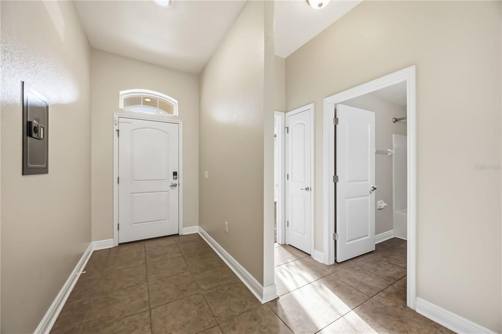 9984 Spring Gulch Lane Punta Gorda, FL 33950 - Photo 4 of 31 an empty room with windows and closet