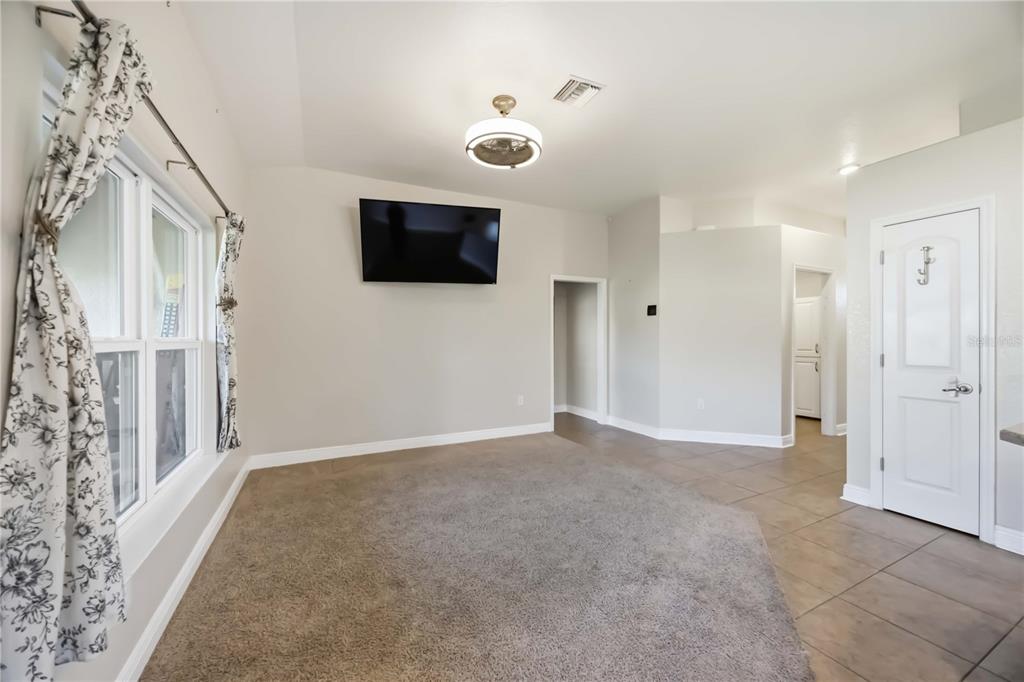 9984 Spring Gulch Lane Punta Gorda, FL 33950 - Photo 7 of 31 a view of a livingroom with an empty space and a hallway