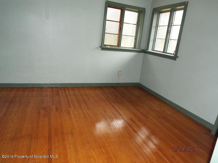 507 O'Hara Road Moscow, PA 18444 - Photo 11 of 13 an empty room with wooden floor and windows