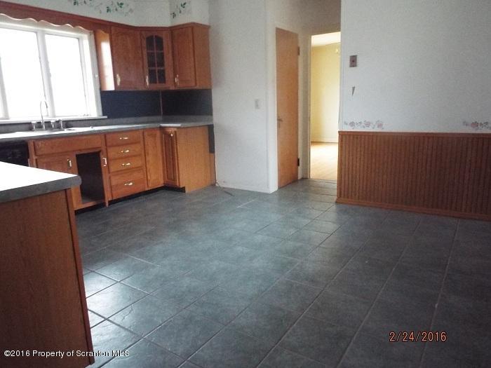 507 O'Hara Road Moscow, PA 18444 - Photo 4 of 13 a kitchen with stainless steel appliances granite countertop a stove a sink and a refrigerator